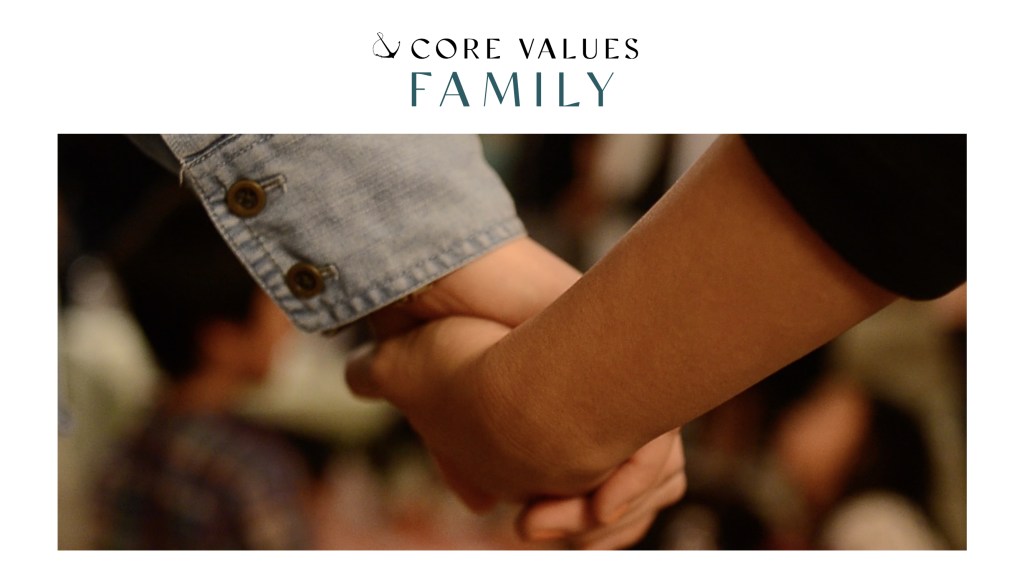 Image of people holding hands in prayer with text: "Core Values: Family"
