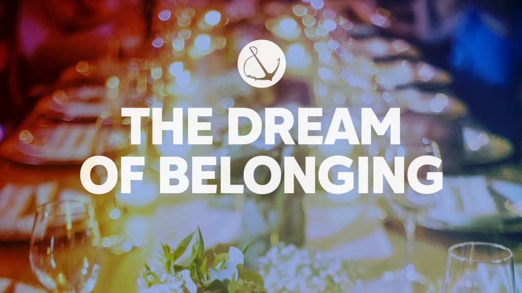 Image of a long banquet table with text overlaid, "The Dream of Belonging"