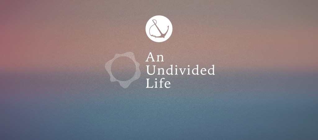 A colorful gradient with text overlaid, "An Undivided Life"